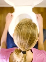 bulimia- woman throwing up in toilet - size zero model - size zero